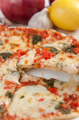 Appetizing pizza with mozzarella cheese and fruit