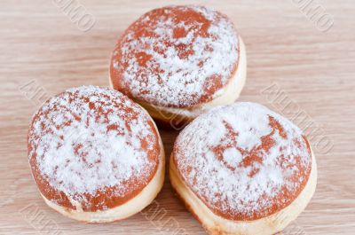Donuts sprinkled with powdered sugar