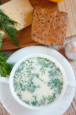 Cheese soup with dill and cereal bread