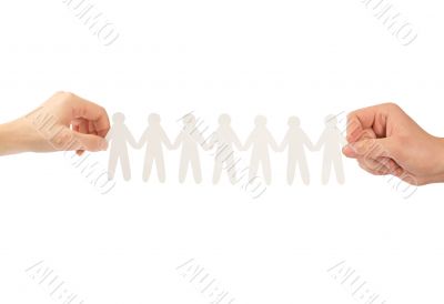 paper people in hands isolated on a white background