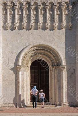 The woman and the girl at temple doors