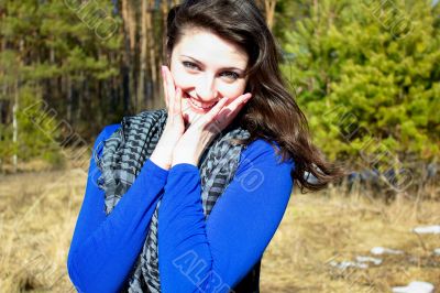 The woman in the woods a fun smiling and her good mood in the days of spring.