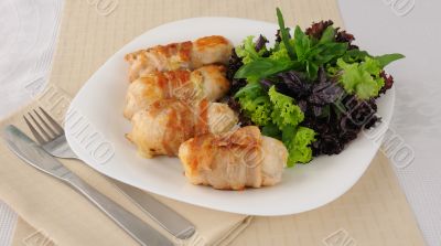 Chicken rolls stuffed with cheese wrapped in bacon Chicken rolls stuffed with cheese wrapped in bacon