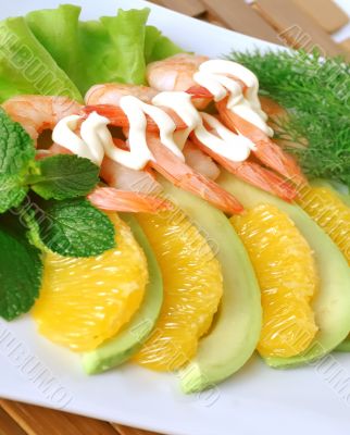 Appetizer of avocado and shrimp with orange