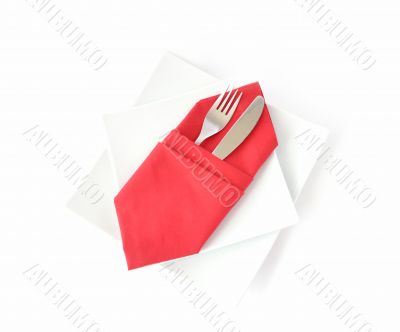 knife and fork in a red napkin