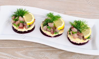 Appetizer with herring and beets Appetizer with herring and beets