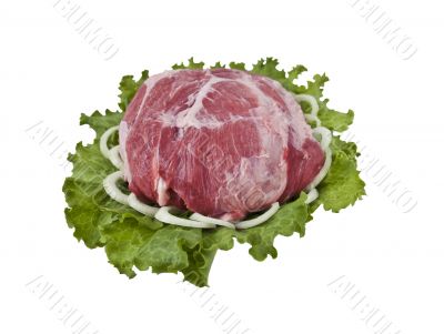 A piece of fresh pork in lettuce leaves with onion A piece of fresh pork in lettuce leaves with onion