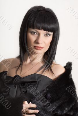 Portrait of a beautiful elegant woman on a white background