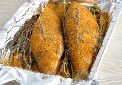 Herring in spices and herbs in foil