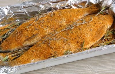 Herring in spices and herbs in foil
