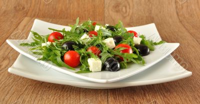 Salad of arugula with cherry tomatoes and grapes