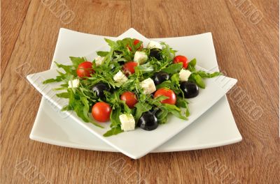 Salad of arugula with cherry tomatoes and grapes