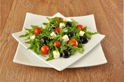 Salad of arugula with cherry tomatoes and grapes Salad of arugula with cherry tomatoes and grapes