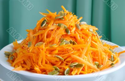 Salad of pumpkin and carrot with pumpkin seeds Salad of pumpkin and carrot with pumpkin seeds