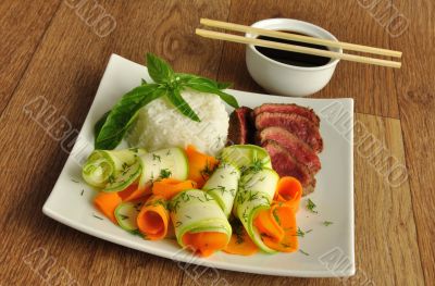 Veal meat with the blood with rice and vegetables