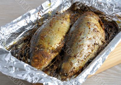 Herring in spices and herbs in foil