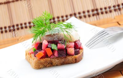 Sandwiches with rye bread, herring and vegetables Sandwiches with rye bread, herring and vegetables