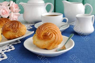 Eclairs with a cup of coffee Eclairs with a cup of coffee