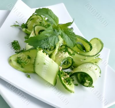 Cucumber salad with greens and sesame