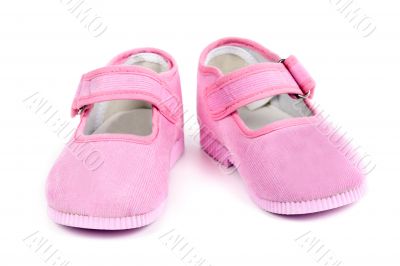 a pair of baby pink shoes