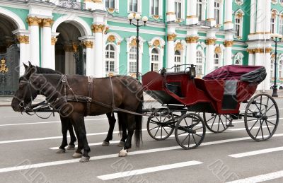 carriage with horses in the background of the Hermitage
