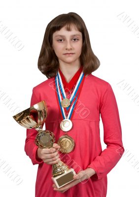 Girl with gold medals and a cup