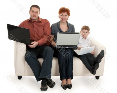 dad mom and son with laptop