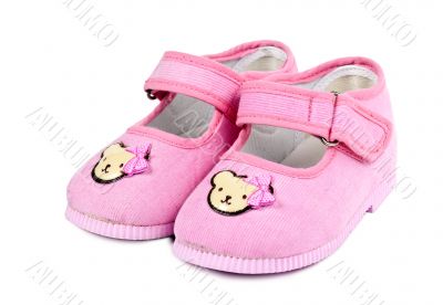 a pair of baby pink shoes