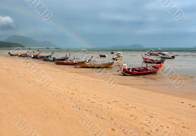 ebb of the sea a boat on the rocks