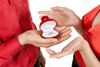 man`s hand gives a box