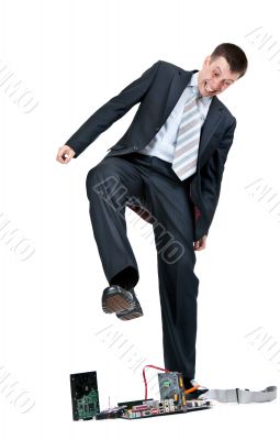 Businessman trampling foot motherboard