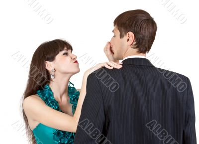 beautiful girl pulls the nose businessman