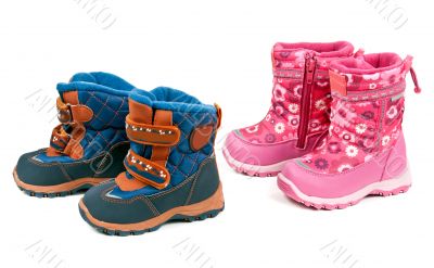Two pairs of baby blue and pink boots