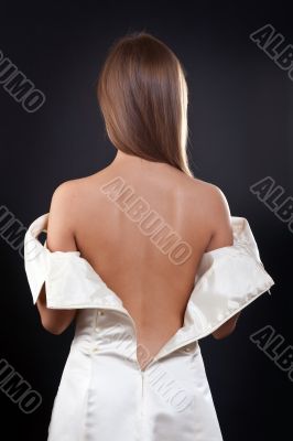 pretty girl with bare back in the studio