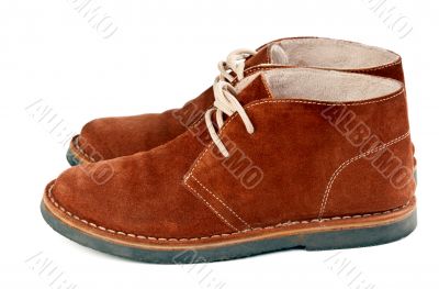 a pair of brown suede shoes
