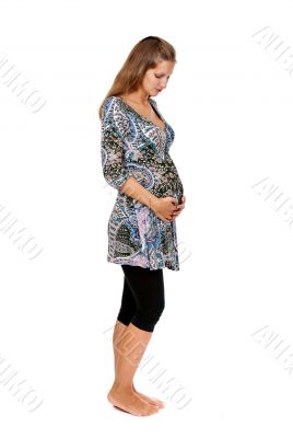 pregnant woman in profile in the studio