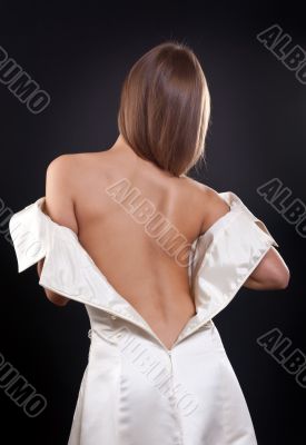 pretty girl with bare back in the studio