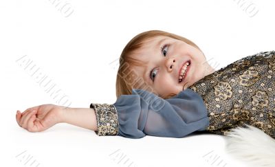 little girl lying on the floor in the studio