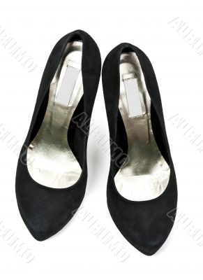 pair of black suede women`s high heel shoes