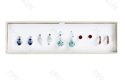 five pairs of earrings with stones