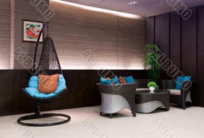 chair hanging on a chain in the hotel lobby sofa 