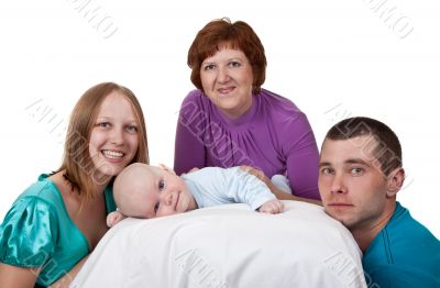 mom, dad and grandmother with a baby