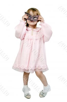 little girl in a fancy mask in studio