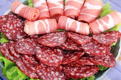 Appetizing sausage and meat on the table