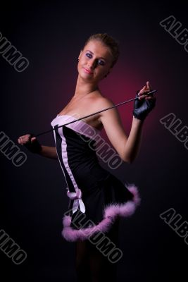 Female model posing in black and pink dress