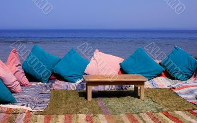 Blanket and table on beach
