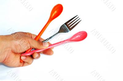 Spoons and fork in hand
