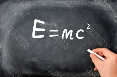 Relativity formula written on a  Blackboard background