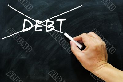 Debt being crossed out on a blackboard 