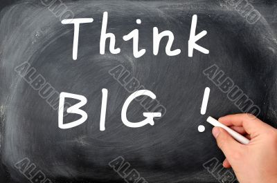 Think big written on a blackboard
